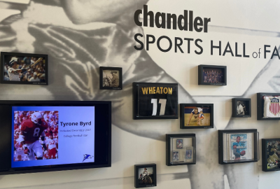 Chandler Sports Hall of Fame written on wall surrounded by framed photos of athletes from Chandler, AZ