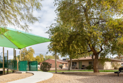 Exterior of public housing site in Chandler with playground in foreground