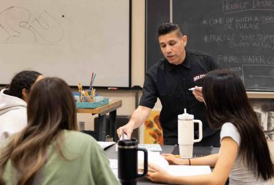 Teacher-in-Classroom-with-three-students