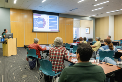 Attendees listen to presenter from Neighborhood Resources at Downtown Library
