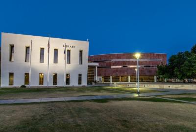 Chandler Public Library exterior photo at dusk