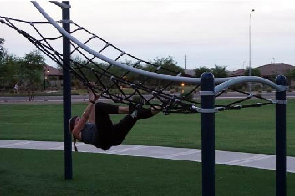 A resident testing their skills at Meadowbrook Park aka Chandler's Ninja Park