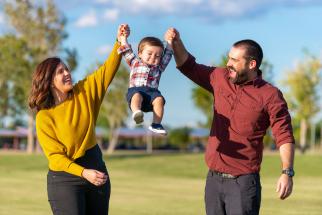 family plays in tumbleweed park