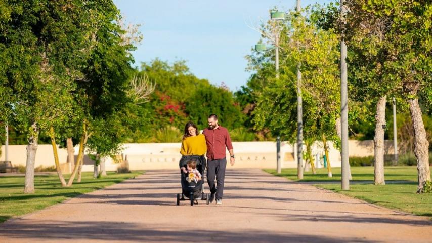 Family walking through Tumbleweed Park