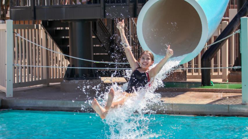 kid going down a water slide