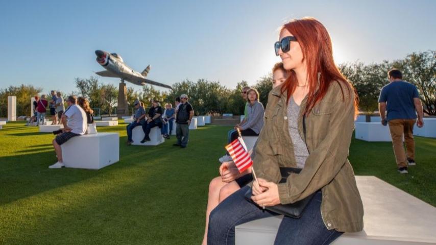 woman attends Veterans Day celebration at Field of Honor