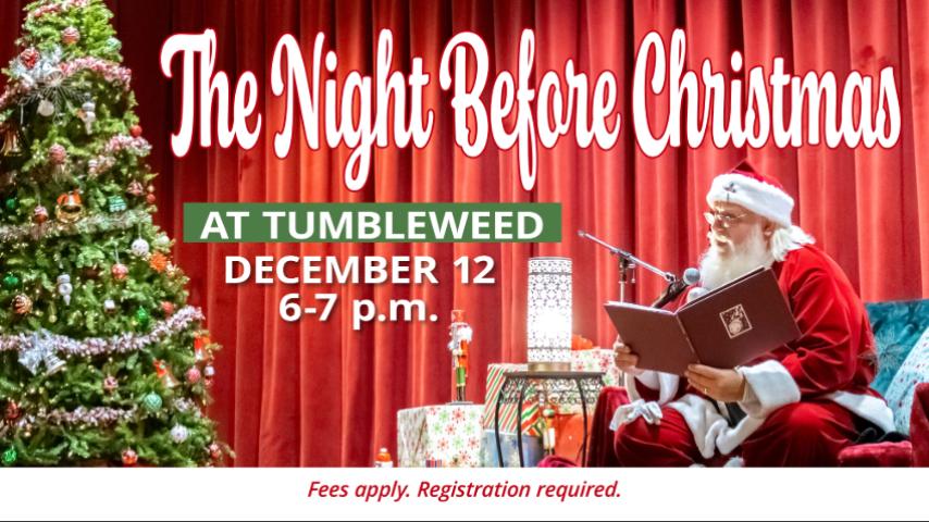 Santa on the stage reading a book