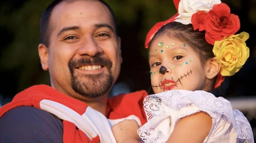 father and daughter at Day of the Dead