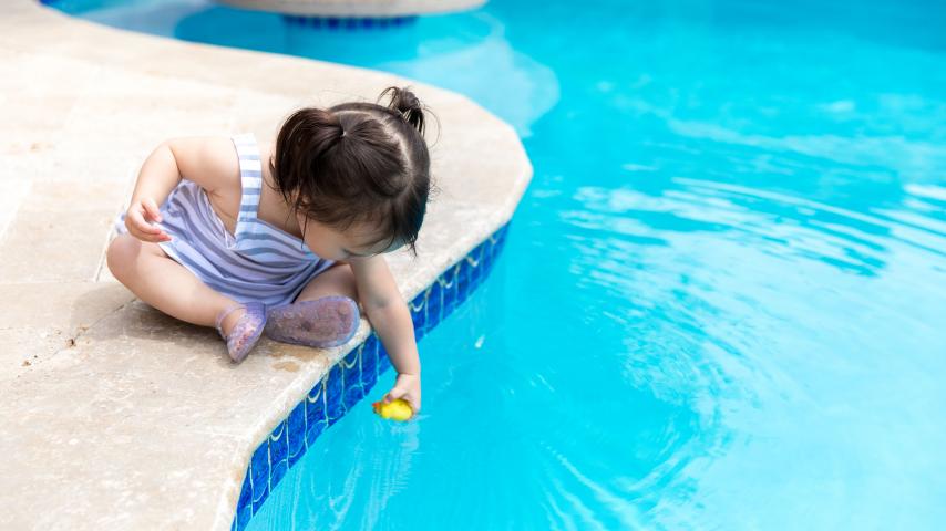 toddler by pool