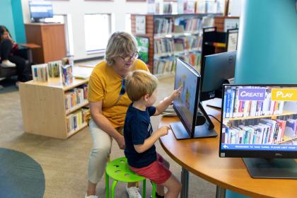 grandmom and grandson at library