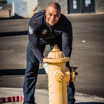 Firefighter opening fire hydrant
