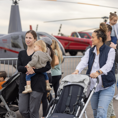 Moms pushing their strollers at Airport Day