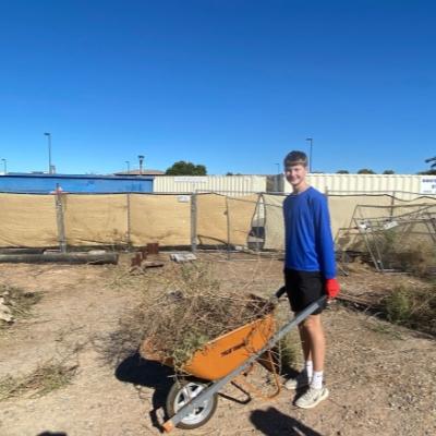 youth clearing empty lot