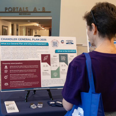 woman looking at general plan informational materials