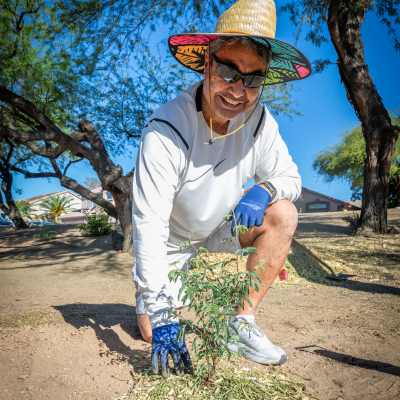 For Our City Day volunteer pulling weeds