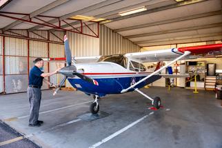 Small aircraft at Chandler Municipal Airport hangar