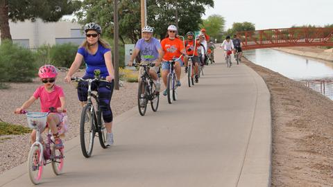Family riding the Paseo Trail