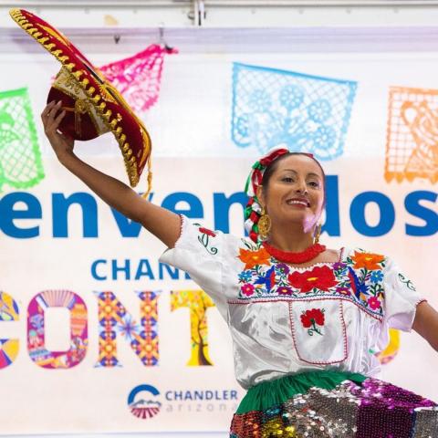Dancer holding up sombrero