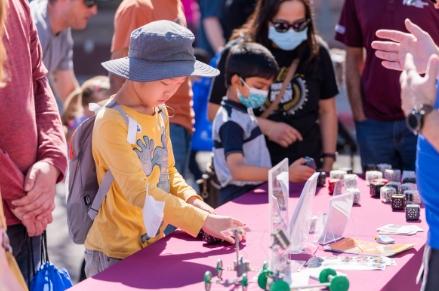 Young boy exploring a hands-on activity at the Chandler Innovation Fair