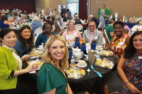 Girl of women (and one male) at a Sister Cities Tea