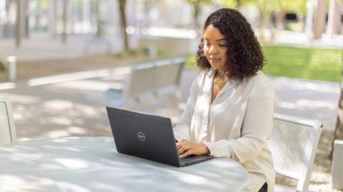 City employee working on a laptop