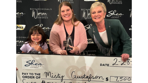 Misty Gustafson with daughter and Beth McDonald holding $7,500 check