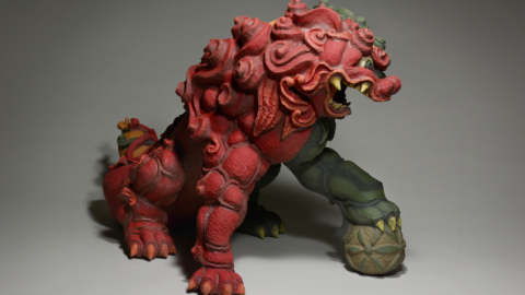 Red and green sculpture of a dragon