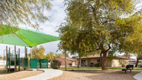 Exterior of public housing site in Chandler with playground in foreground