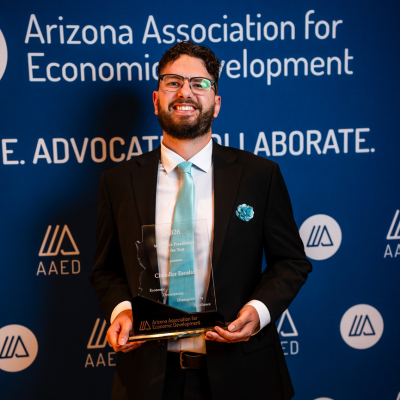 Chandler Escalante holding award for 2026 Workforce Practitioner of the Year