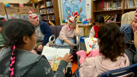 Golden Neighbors reading to students