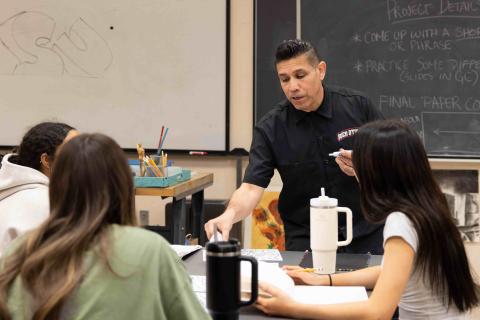 Teacher-in-Classroom-with-three-students