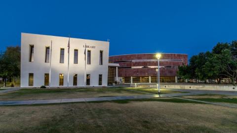 Chandler Public Library exterior photo at dusk