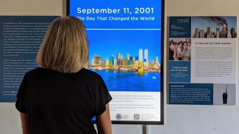Photo of woman at 9/11 exhibit