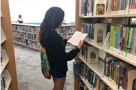 A girl reading at the Chandler Public Library