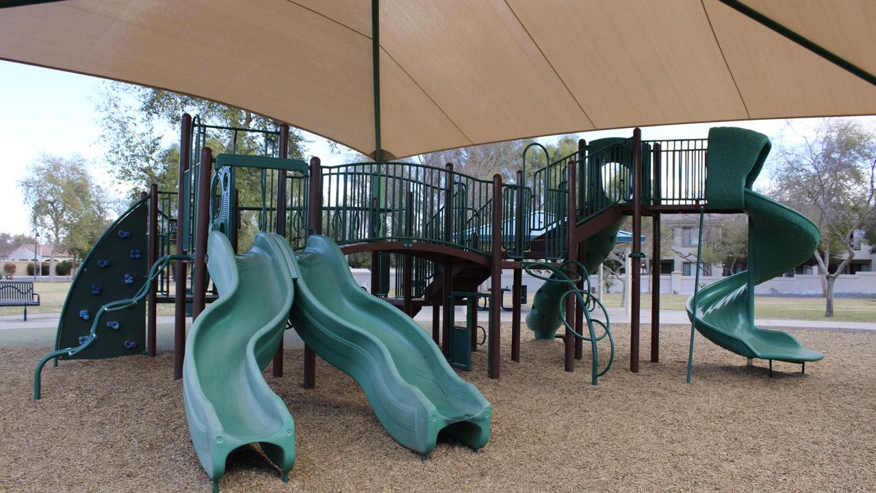 Playground climbing wall and slides at Blue Heron Park
