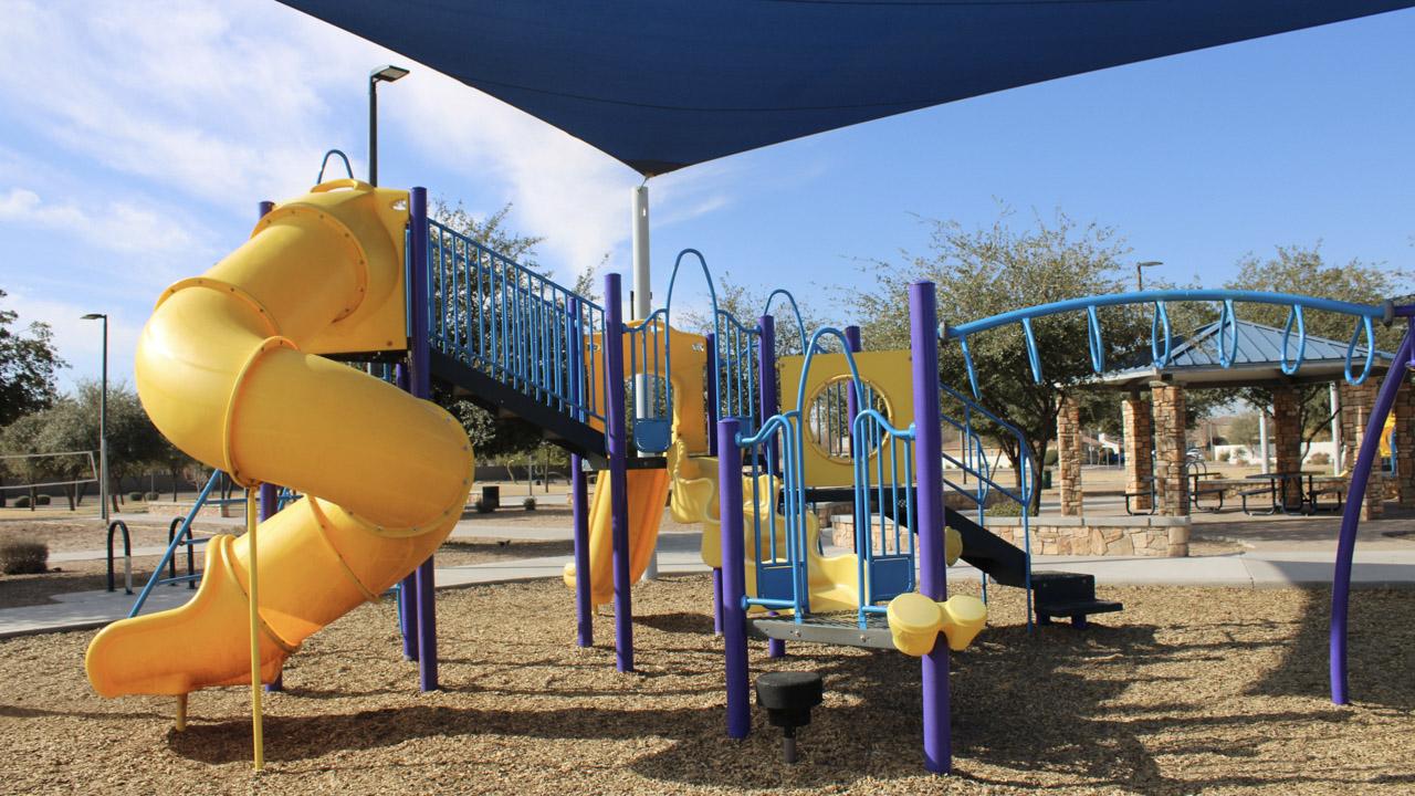 Playground monkey bars and slide at Centennial Park