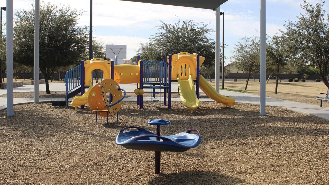 Small playground with three slides at Centennial Park