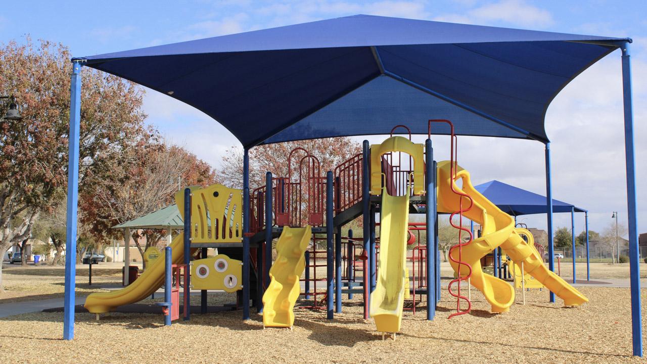 Playground with four slides and climbing features at Chuckwalla Park