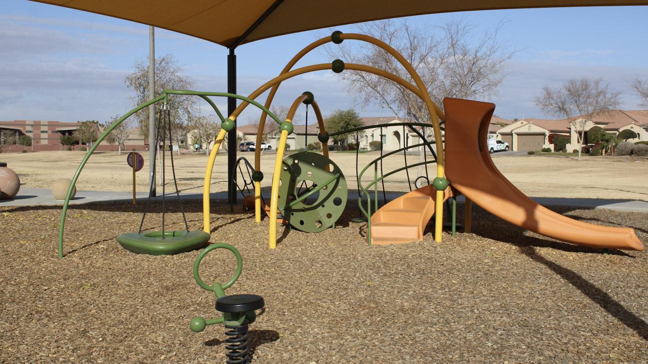 Play area with slide and spring rider at Citrus Vista Park