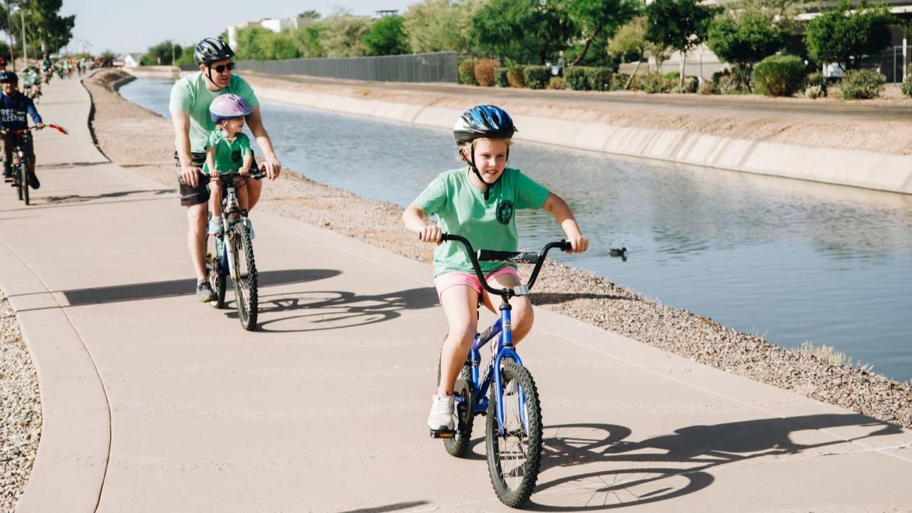 Family Riding Bikes On Paseo Trail