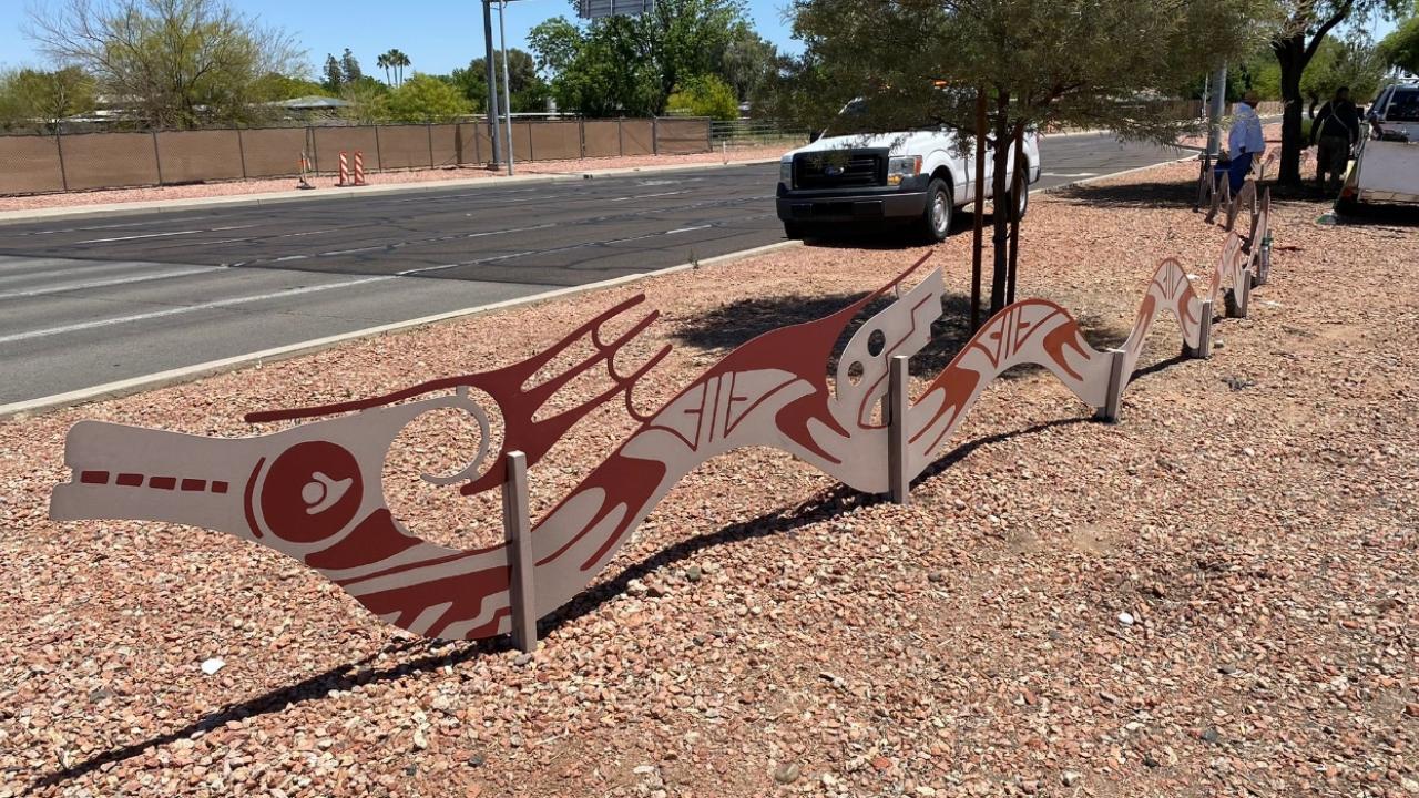 Landscape maintenance hardscape with a serpent display.