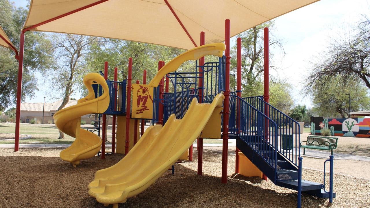 Playground with triple slide and stairs at Harter Park