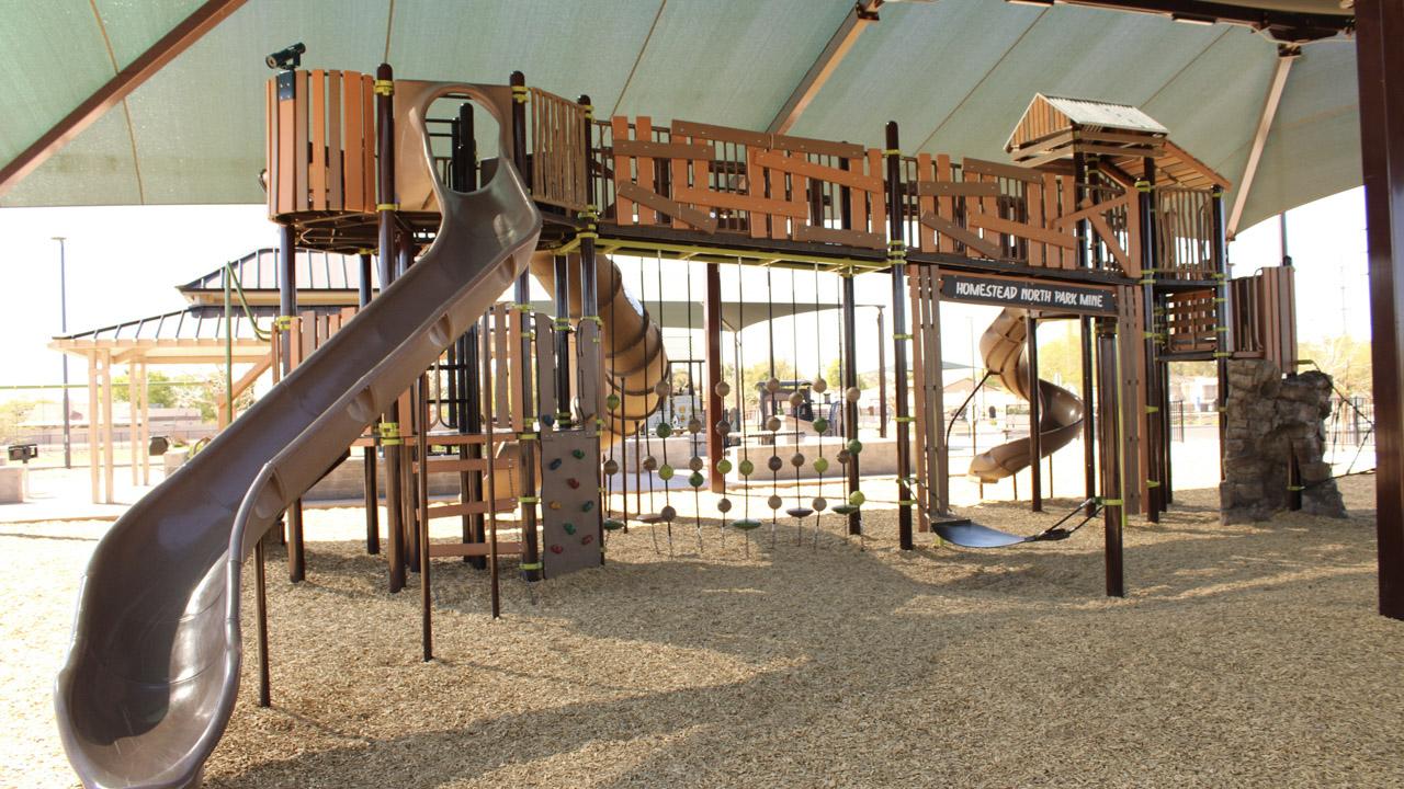 Playground slide and climbing wall at Homestead North Park