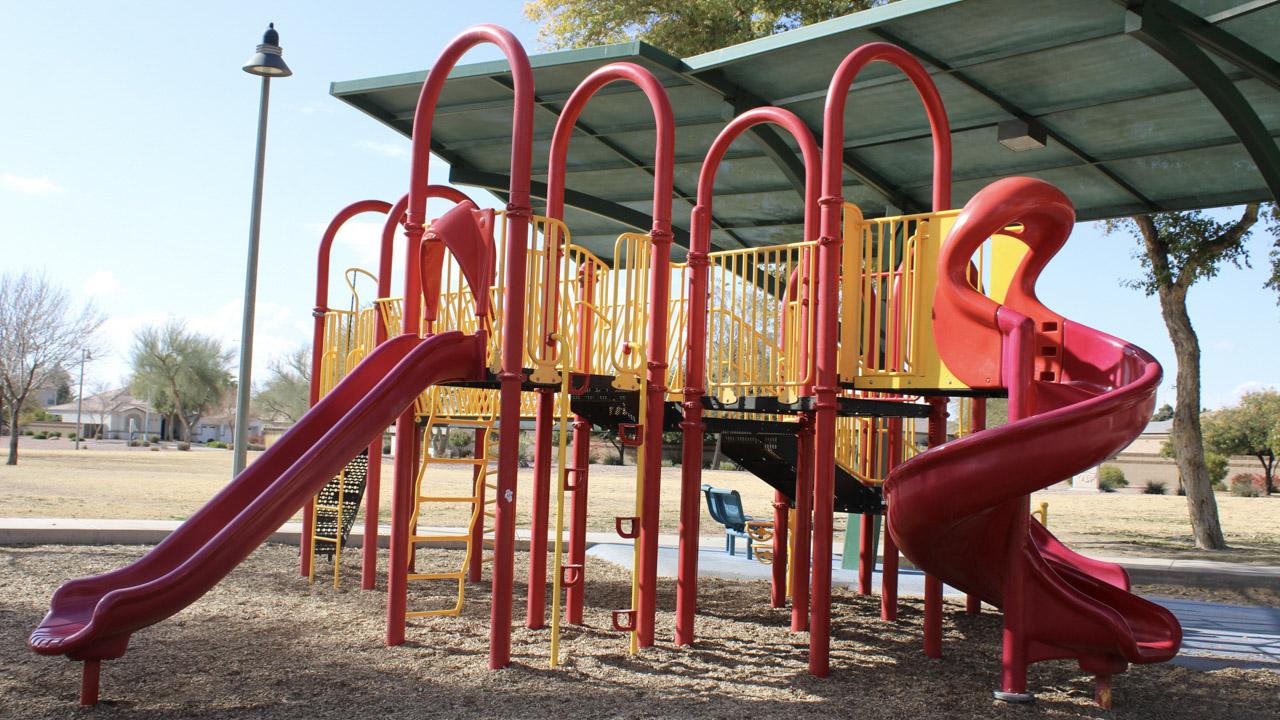 Playground slides and climbing features at La Paloma Park
