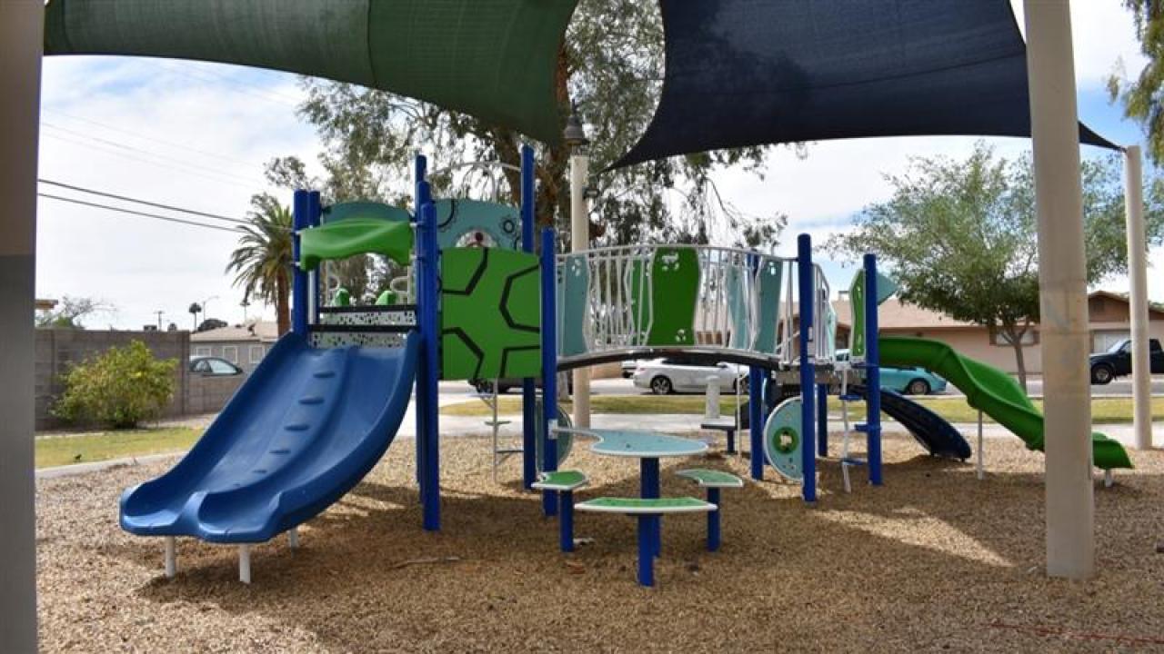 Playground With Slides And Climbing Features At Park Manors Park