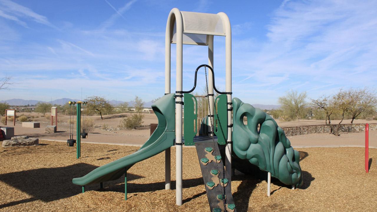 Play structure with climbing wall and slide at Paseo Vista Recreation Area