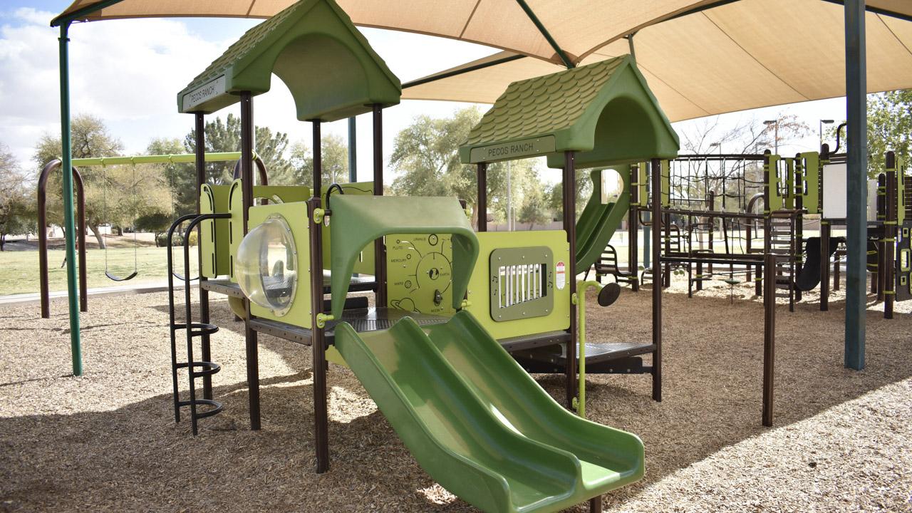 Playground with double slide and music player at Pecos Ranch Park