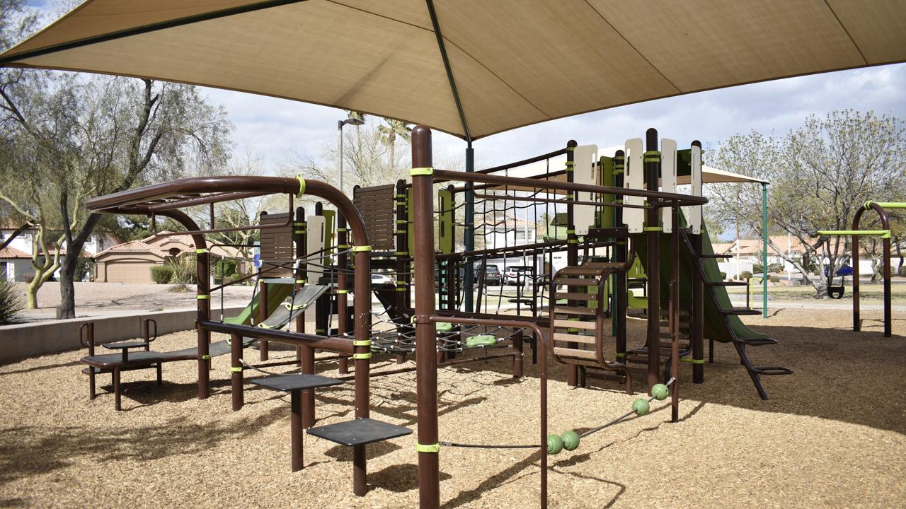 Playground monkey bars and climbing features at Pecos Ranch Park