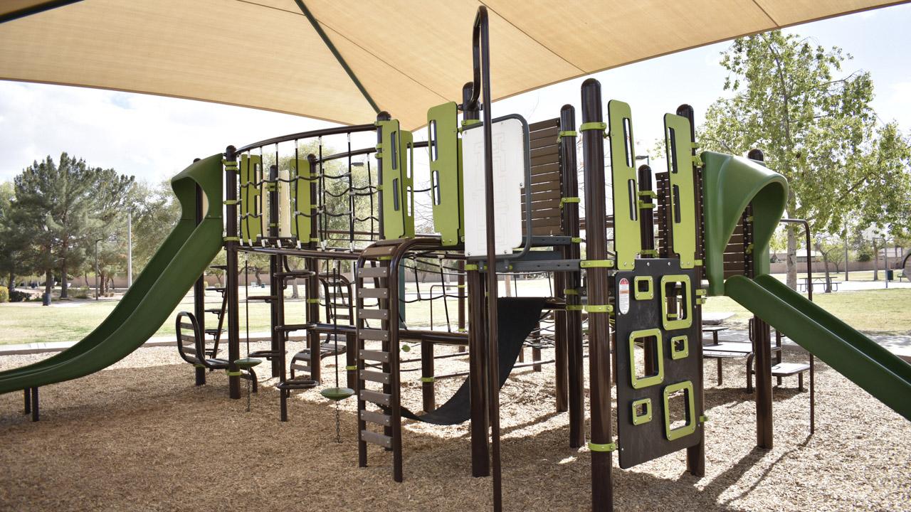 Playground slides and climbing features at Pecos Ranch Park