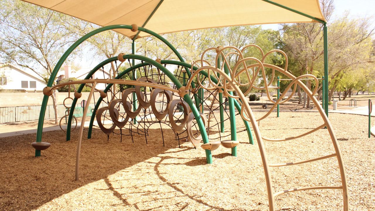 Playground climbing structure at Pine Shadows Park